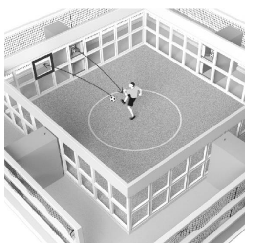 Fußballspieler auf einem kleinen Spielfeld beim Schuss auf das Tor.